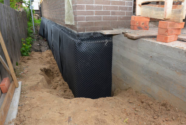 SJ Waterproofing Pros technician performing targeted Waterproofing assessment in Newtonville, NJ